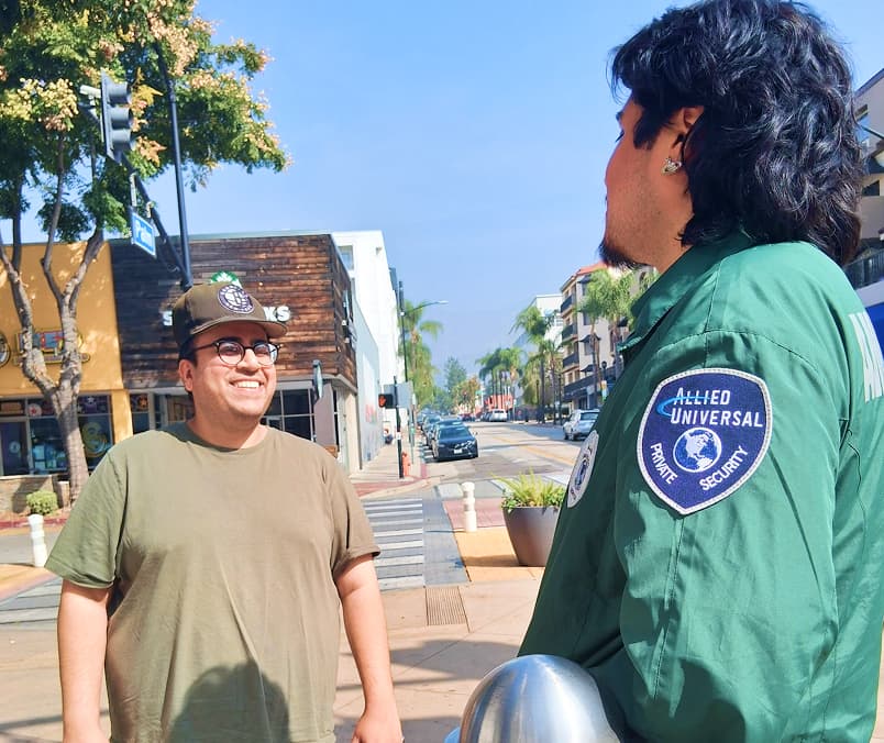 Ambassador speaking with a visitor on a Downtown Burbank street