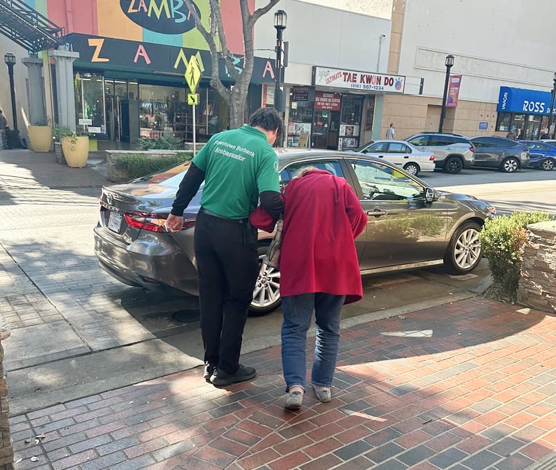 Ambassadors assisting a community member in Downtown Burbank